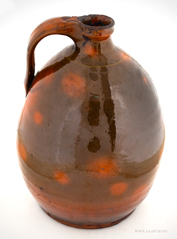 Redware Jug, Ovoid, Molded Neck, Ribbed Strap Handle, Thumbprint Terminal
Probably Essex County, Massachusetts,
circa 1790-1830, angle view