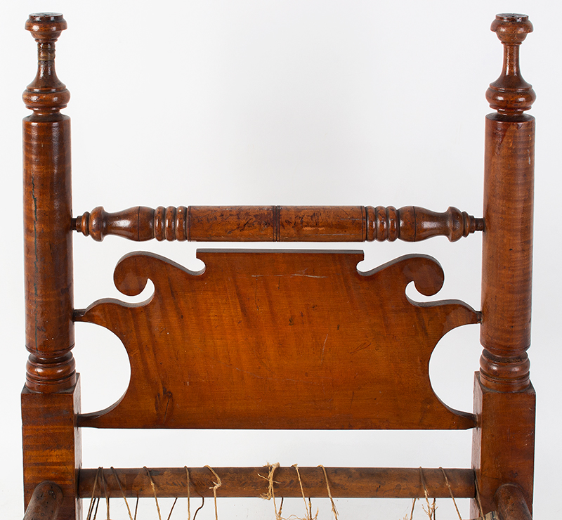 Large Antique Doll Bed, Curly Maple, Scrolled Headboard
Pennsylvania, Philadelphia Area, circa 1830
A generously proportioned bed, will comfortable accommodate a 25-inch doll, headboard view