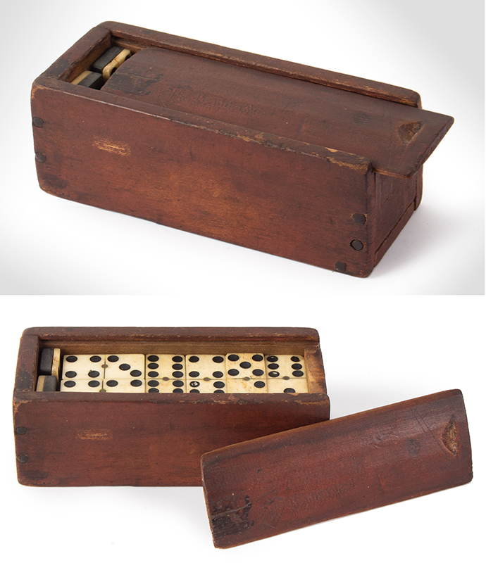 Ivory Dominoes in red slide lid box. Box is dated in pencil on bottom 1874., entire view