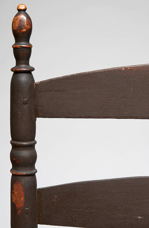 Ladder Back Rocking Chair, Human Effigy Arm Terminuses Extraordinary Example of Colonial and Native American Collaboration The arm terminals carved with faces are in the manner of the Penobscot Indians Coastal New England, Likely New Hampshire, or Maine, detail view 3