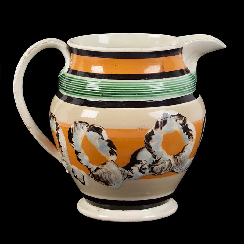 Mochaware Pitcher Featuring a Rare Engine Turned Empire Bulge Under Rim